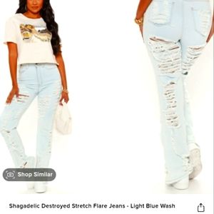 Fashion Nova distressed stretch flare leg jeans.